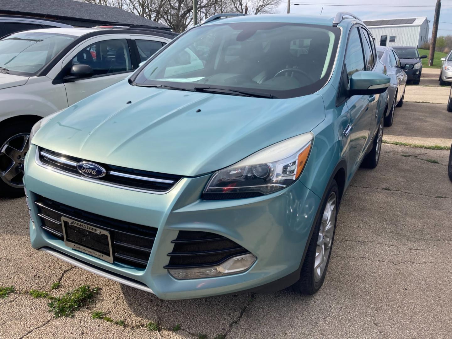 2013 Frosted Glass Met. Ford Escape Titanium FWD (1FMCU0J91DU) with an 2.0L L4 DOHC 16V engine, 6-Speed Automatic transmission, located at 1800 South Ihm Blvd, Freeport, IL, 61032, (815) 232-5543, 42.278645, -89.607994 - Photo#0